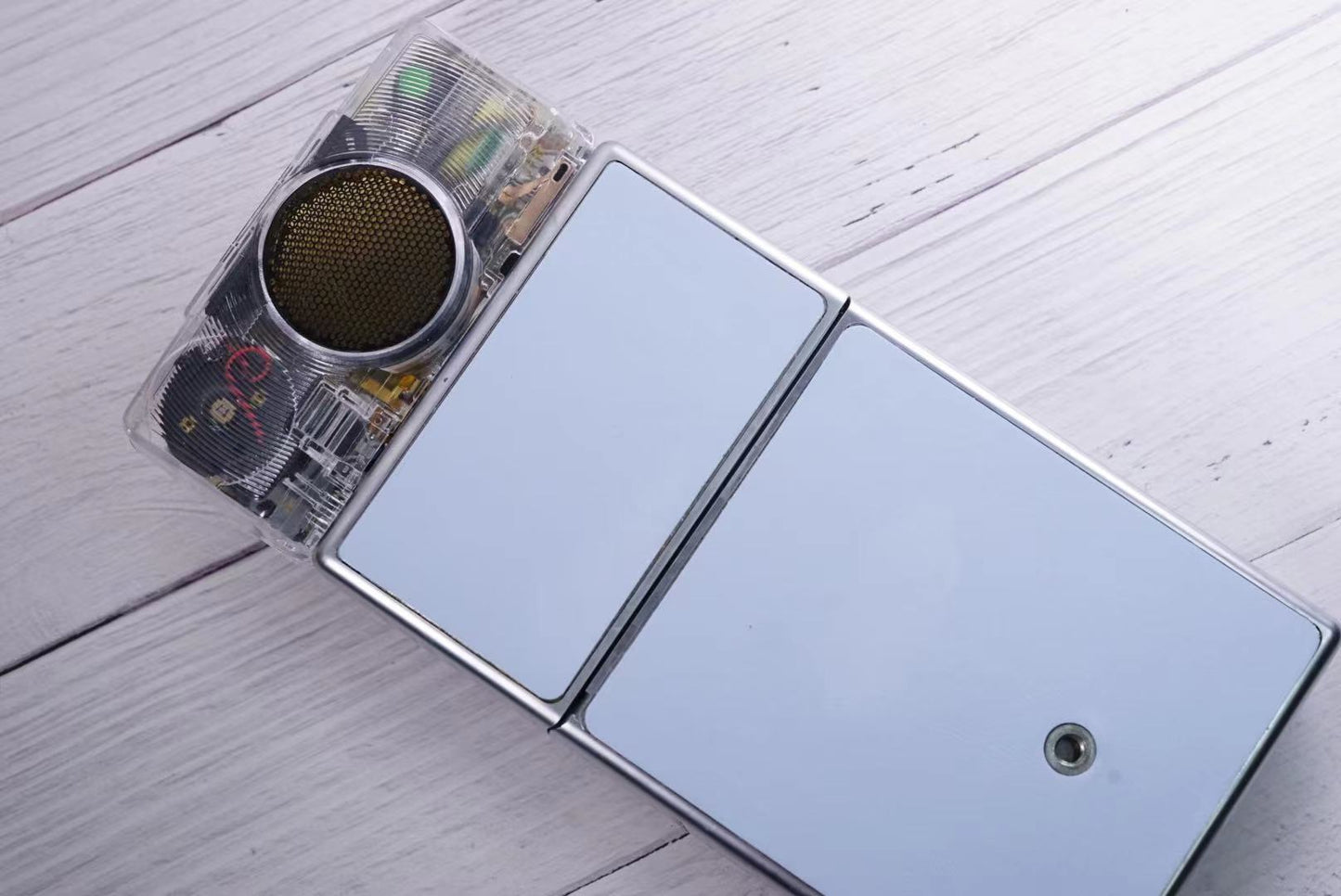 Polaroid SX70 SONAR Transparent vision ISO600 BABY BLUE Shutter button