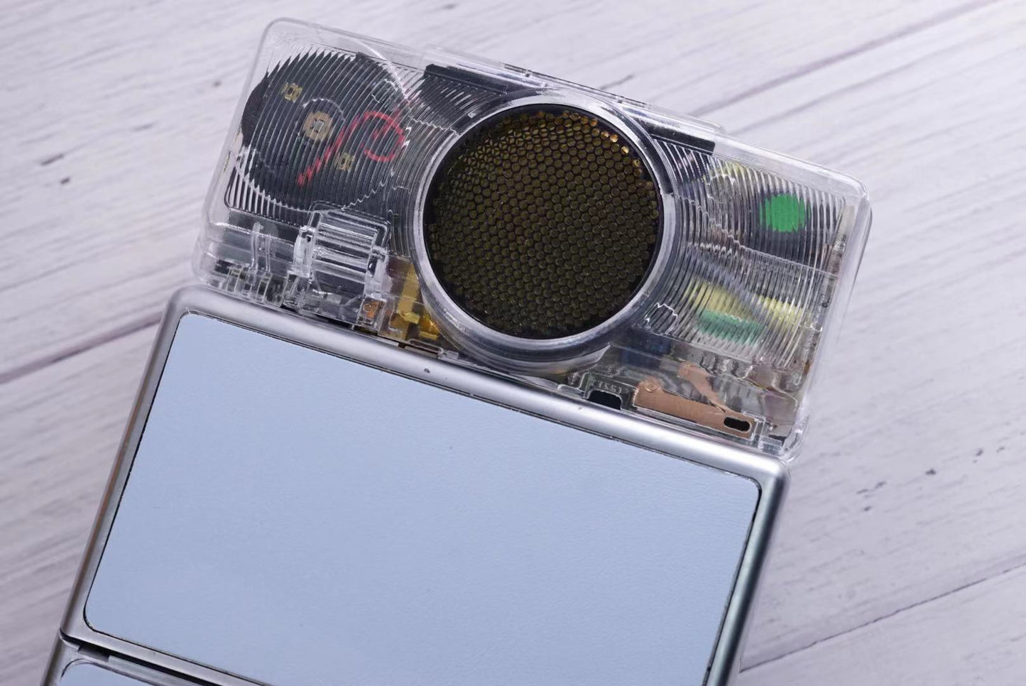 Polaroid SX70 SONAR Transparent vision ISO600 BABY BLUE Shutter button