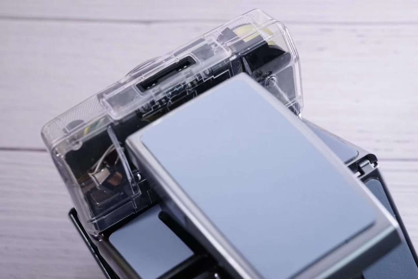Polaroid SX70 SONAR Transparent vision ISO600 BABY BLUE Shutter button