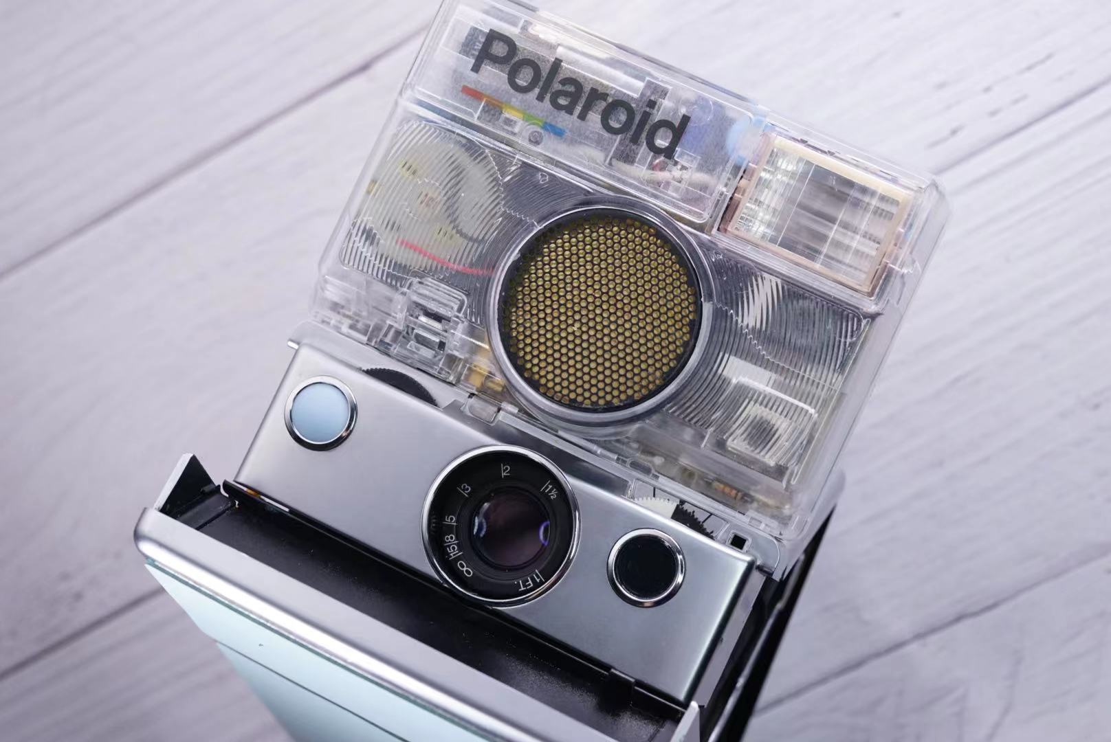 Polaroid SLR680 Transparent vision ISO600 BABY BLUE Shutter button