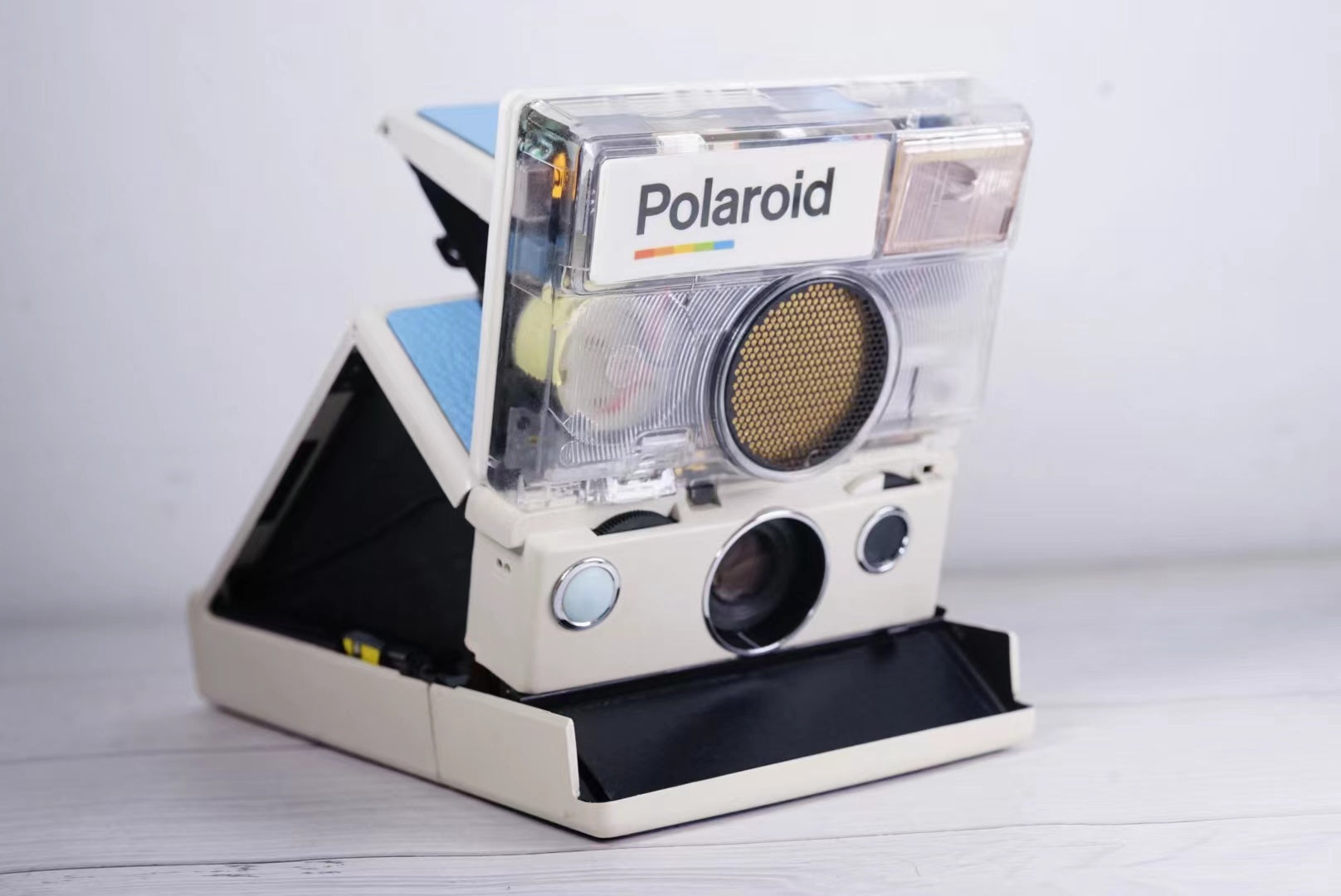 Polaroid SLR 680 White Body transparent Blue shutter button